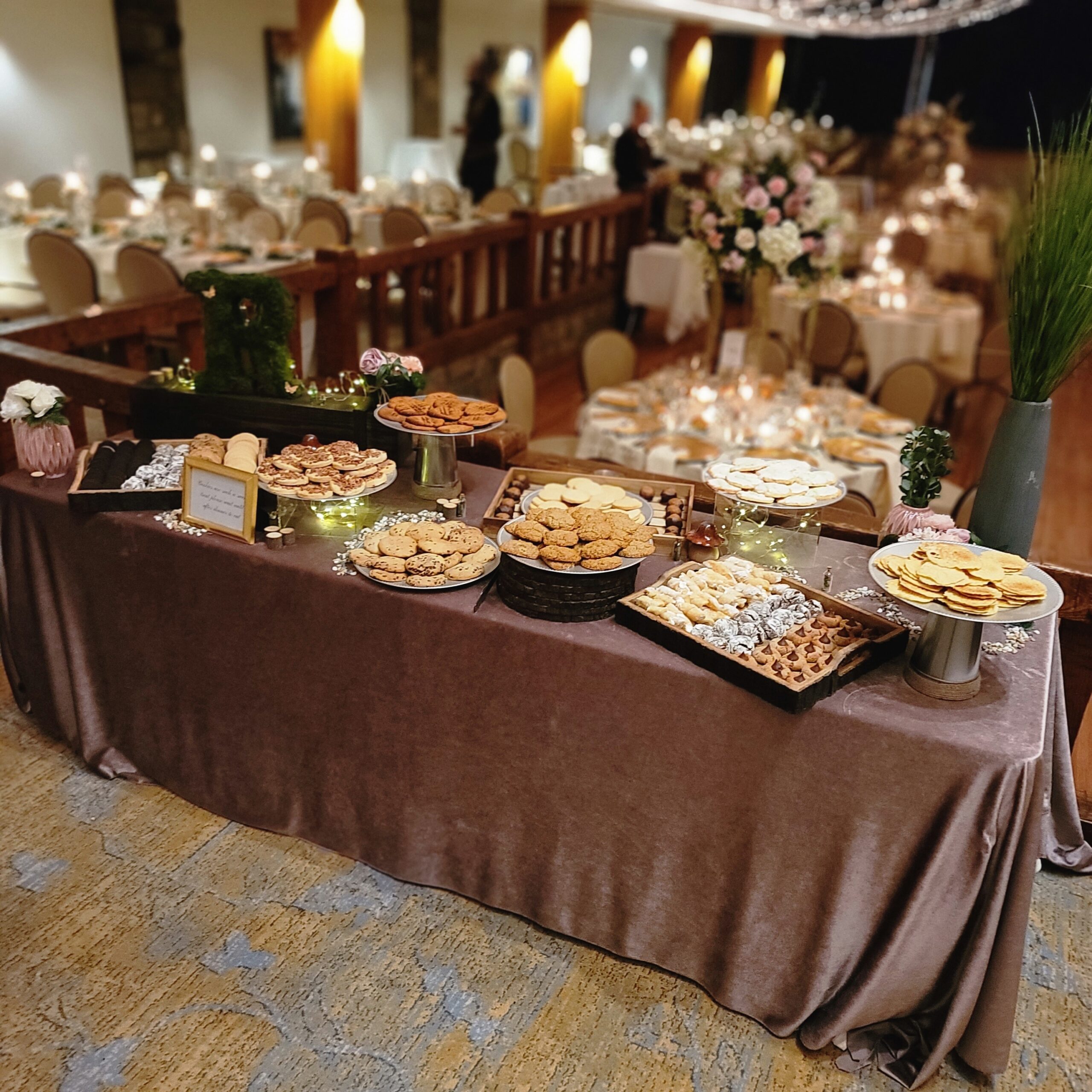 a long table is set up with desserts