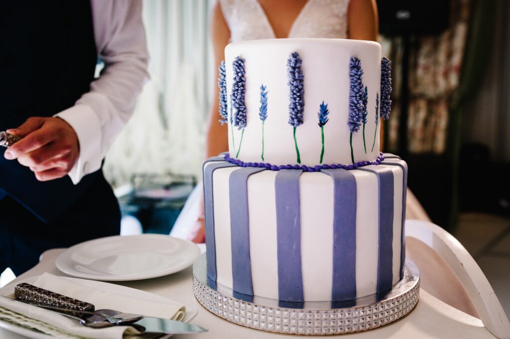 a wedding cake with blue and white stripes