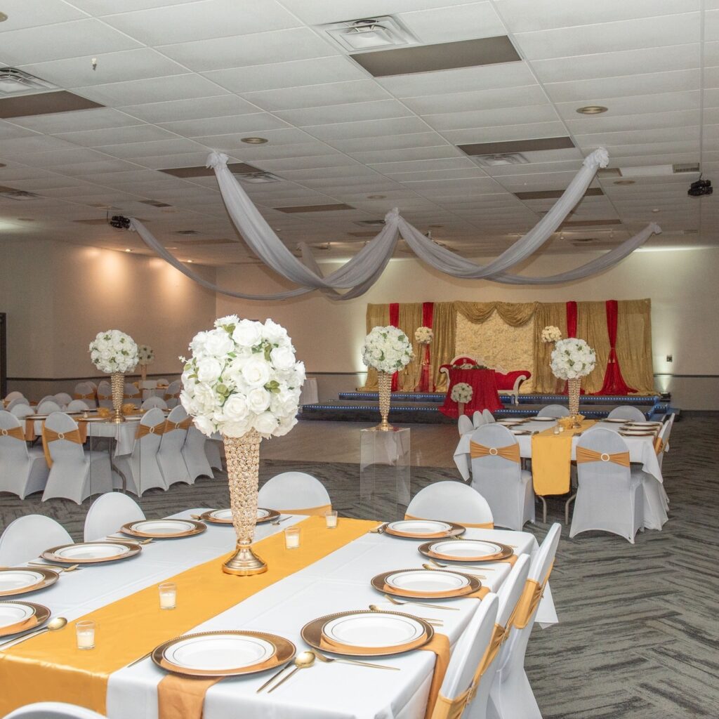 a banquet hall with tables settings and chairs set up for a formal function