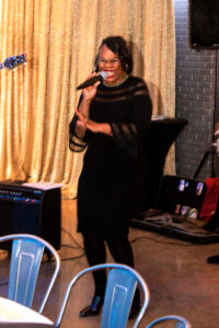 a woman standing in front of a microphone