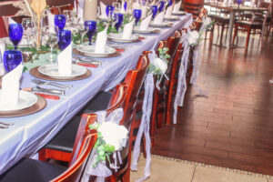 a long table set with blue and white dishes