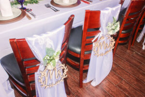 the chairs are covered with white table cloths