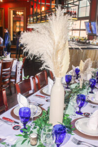 a table set with blue and white place settings