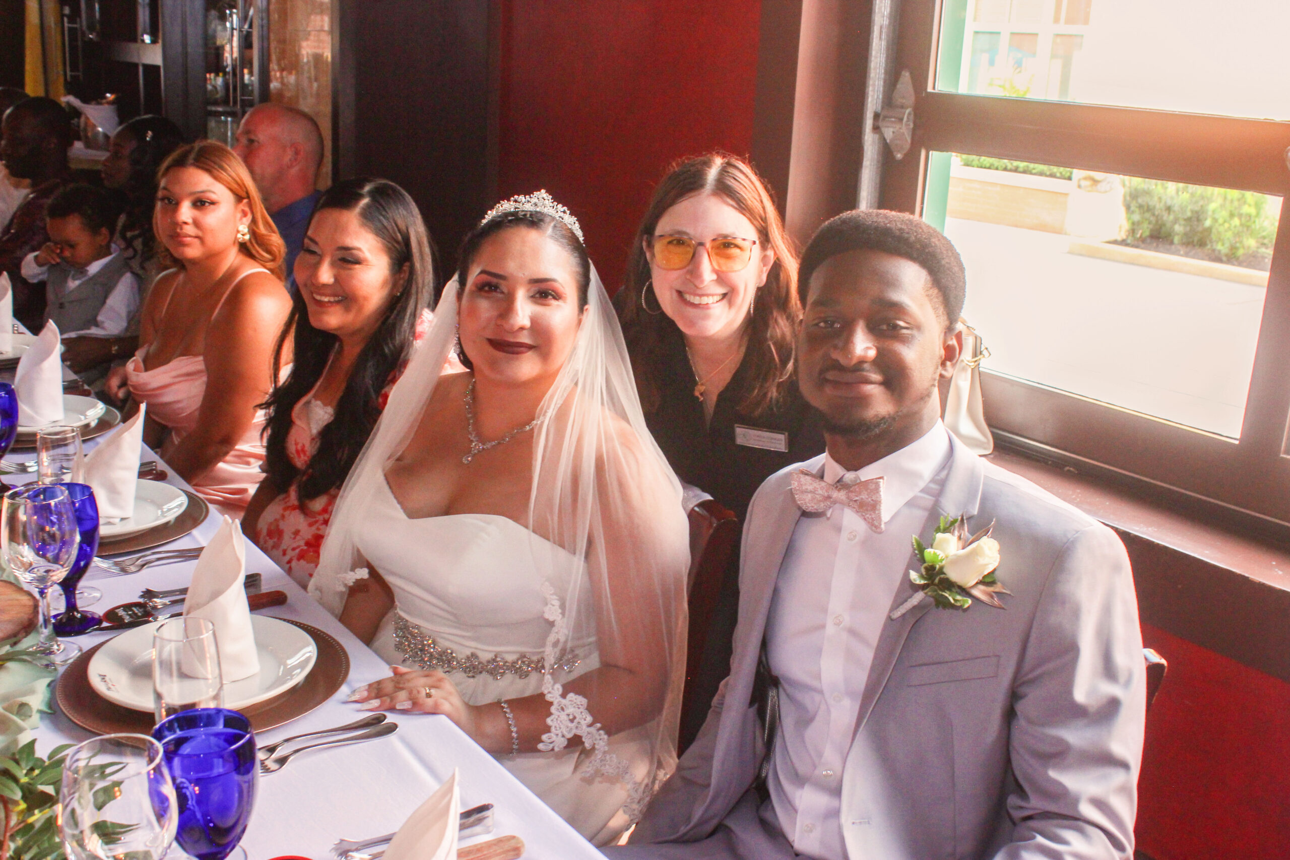 a group of people sitting at a table