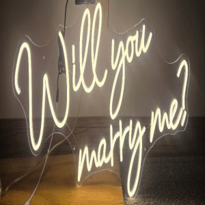 a neon sign that says, will you marry me?