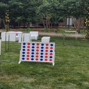 a yard with a lawn game set up in the middle of it