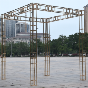 a group of metal structures sitting on top of a cement ground