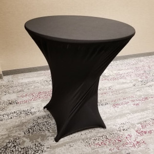 a black round table with a curved top