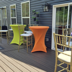 a deck with a table and chairs on it