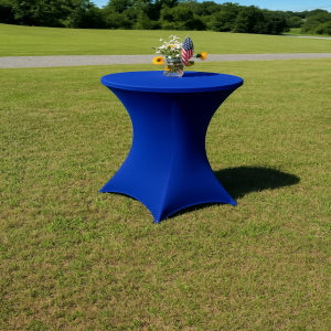 a blue table sitting in the middle of a field