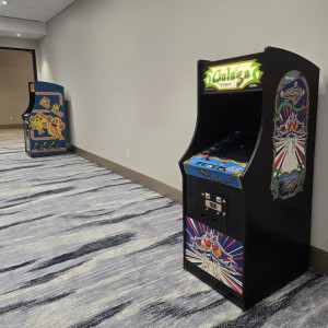 a room with two arcade machines in it