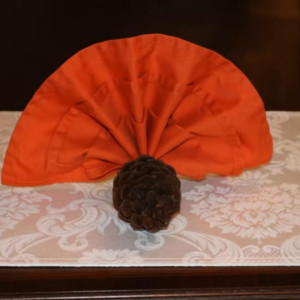 a piece of furniture with an orange cover on top of it