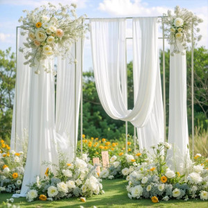 an outdoor ceremony with white drapes and flowers