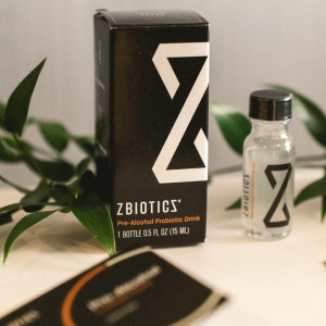 a box of z biotics next to a plant