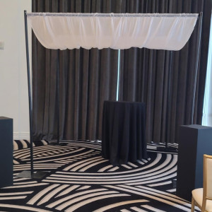 a room with a black and white carpet and a black and white table