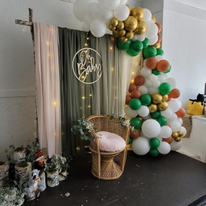 a room with balloons and a chair