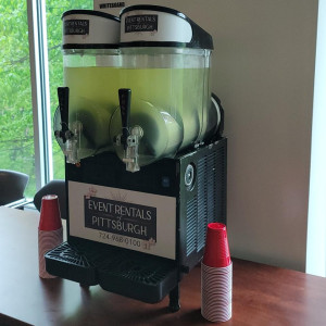a coffee machine sitting on top of a wooden table