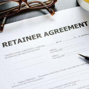 a pair of glasses sitting on top of a paper next to a cup of coffee
