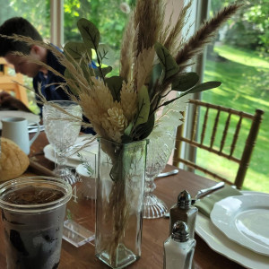 a table with a vase of flowers on it