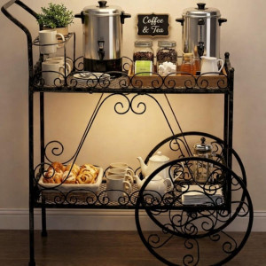 a metal cart with a tray of food on top of it