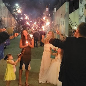 a group of people holding sparklers in their hands