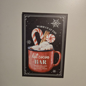 a picture of a hot cocoa bar with candy canes and marshmallows