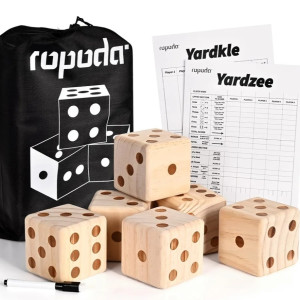 a set of wooden dices sitting next to a bag