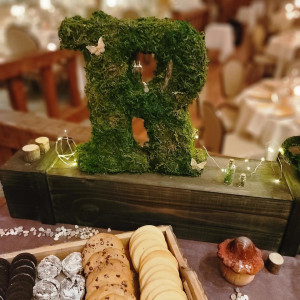 a table topped with a wooden box filled with lots of food