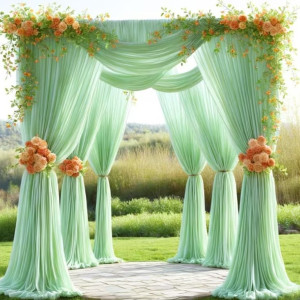 a green wedding arch with flowers on it