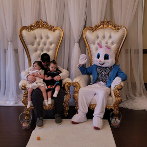 Professional Easter Bunny entertainer wearing a blue vest interacting with children at a luxury Easter event in Pittsburgh