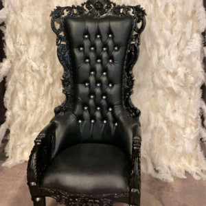 Black velvet throne chair with ornate frame used as luxury royal seating at an upscale event in Pittsburgh