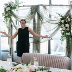 Blush pink velvet loveseat with curved back and gold legs styled at a romantic Pittsburgh event