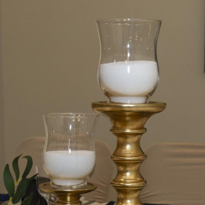 Sand wax pillar candles providing soft ambient candlelight on an elegant event table in Pittsburgh