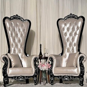 White pearl leather throne chair with black trim used as luxury focal seating at an upscale Pittsburgh event