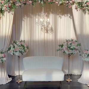 Ivory velvet loveseat with gold legs styled at a Pittsburgh wedding reception