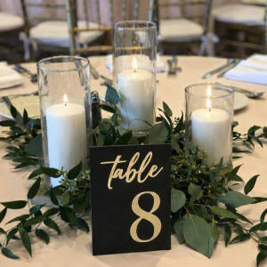 a table with candles and a table number on it