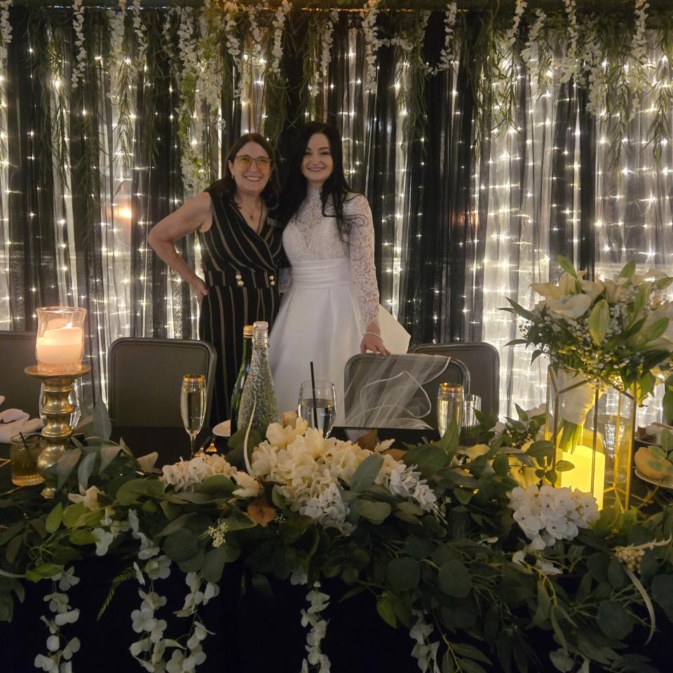 Gold hexagon terrarium lantern with glass panels and candlelight styled on an elegant wedding reception table in Pittsburgh