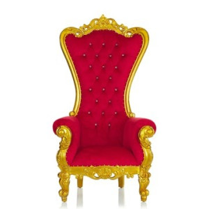 Red velvet throne chair with ornate gold trim used as royal seating at a luxury event in Pittsburgh