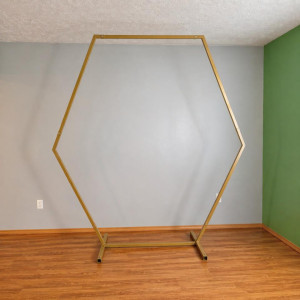 Gold hexagon arches used as a modern ceremony or event backdrop for weddings and luxury events in Pittsburgh.